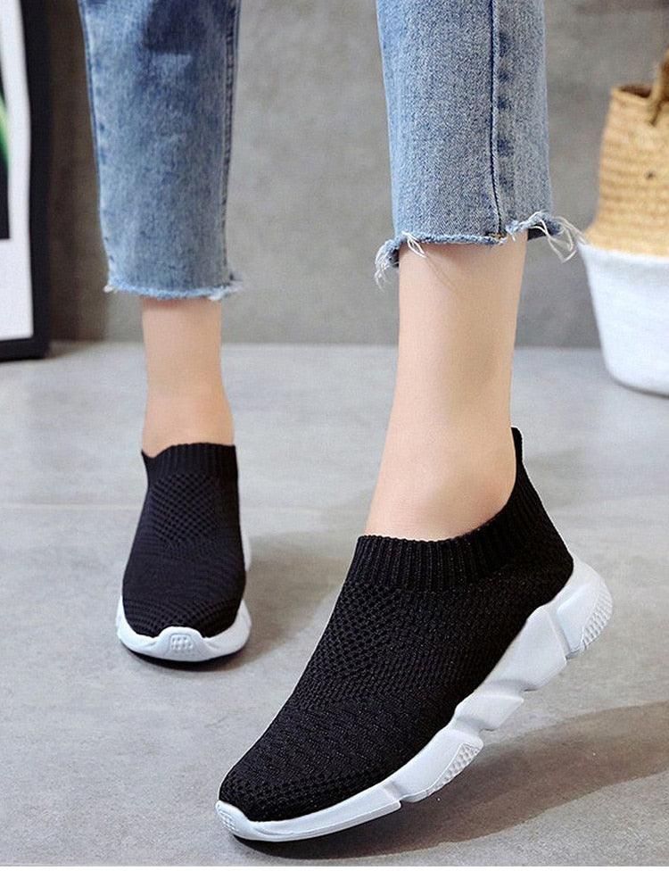 Stevvex women slip-on knit sneakers with black mesh upper and white lightweight sole on Tampa Home & Garden Store