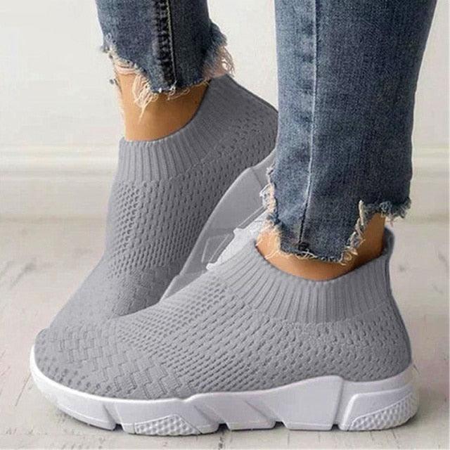 Women slip-on knit sneakers in grey with a white chunky sole; breathable mesh upper, pair on Tampa Home & Garden Store