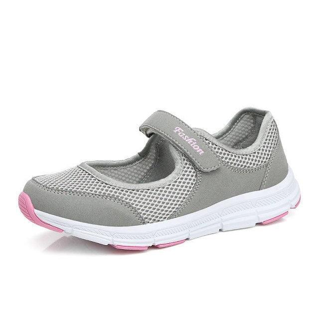 Stevvex women sneakers with breathable gray mesh upper, velcro strap and pink outsole accents on Tampa Home & Garden Store