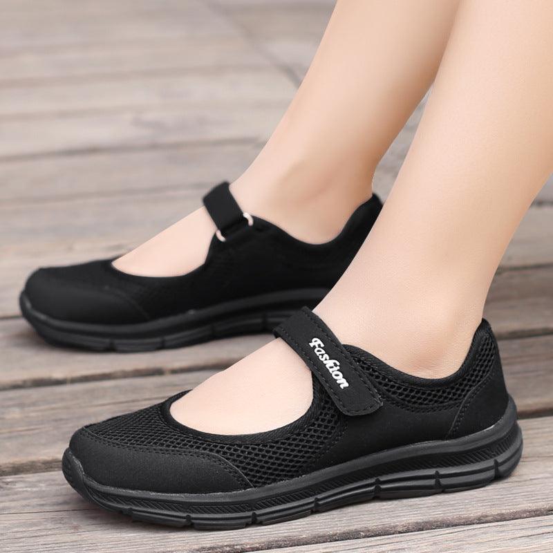 Pair of women mesh espadrille sneakers Velcro strap, black slip-on with cushioned sole on Tampa Home & Garden Store