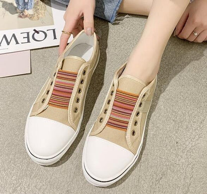 Stevvex women's beige canvas lowcut sneakers with white toe caps and striped slip-on walking flats on Tampa Home & Garden Store