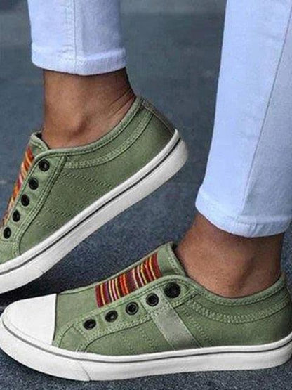 Stevvex women's green canvas sneakers, low-cut slip-ons with striped tongue and white toe cap on Tampa Home & Garden Store