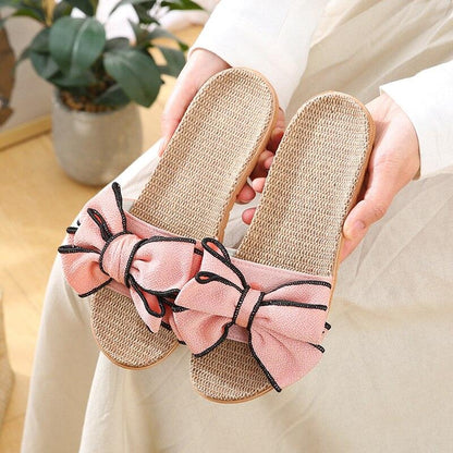 Women Casual Linen Slippers by Stevvex with pink bow detail, woven straw sole, pair on Tampa Home & Garden Store
