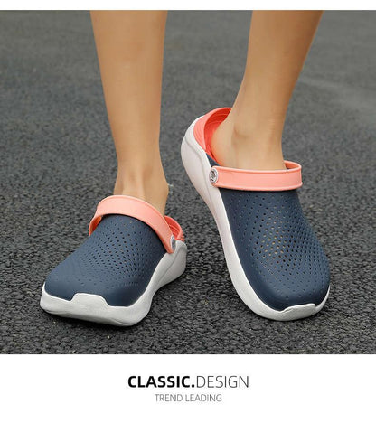 Women's navy perforated slip-on sandals Stevvex with coral pink strap and white sole on Tampa Home & Garden Store