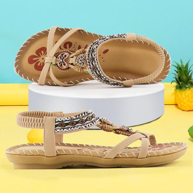Sandals Stevvex rhinestone butterfly-knot beige elastic ankle strap pair on display on Tampa Home & Garden Store