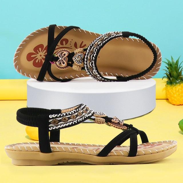 Stevvex butterfly-knot rhinestone sandals with elastic ankle strap, black and tan, 2 shown on Tampa Home & Garden Store