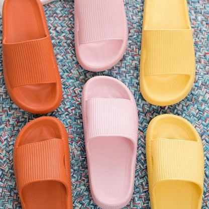 Three colorways of women platform EVA slippers in orange, pink, yellow with ribbed straps on Tampa Home & Garden Store