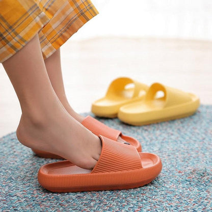 Women thick platform slippers with open toe in orange EVA, ribbed strap; yellow pair visible on Tampa Home & Garden Store