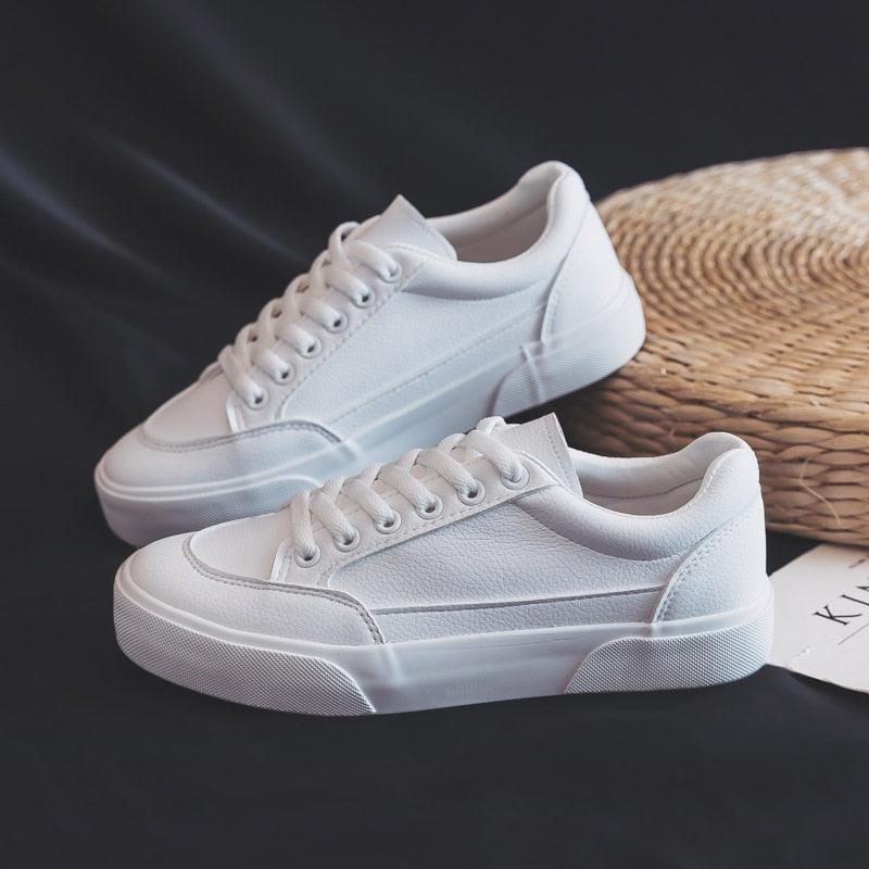 Women’s white platform sneakers with chunky sole and lace-up design, 2 pairs shown on Tampa Home & Garden Store