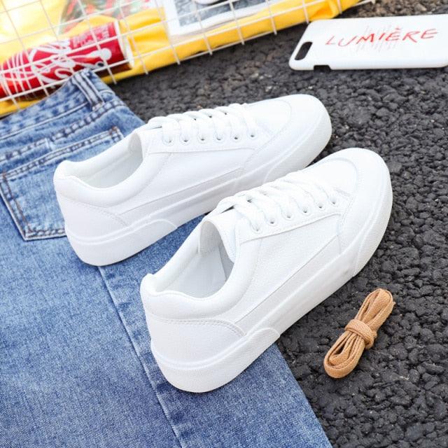 White womens platform sneakers, lace-up, ultra lightweight, non-slip business pair on denim on Tampa Home & Garden Store