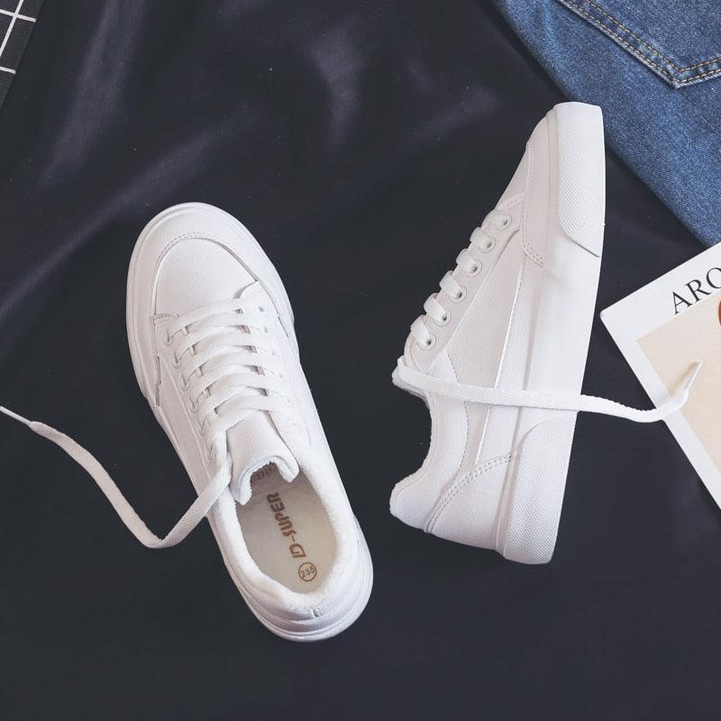 Pair of white Stevvex sneakers with lace-up casual sport style sole on Tampa Home & Garden Store