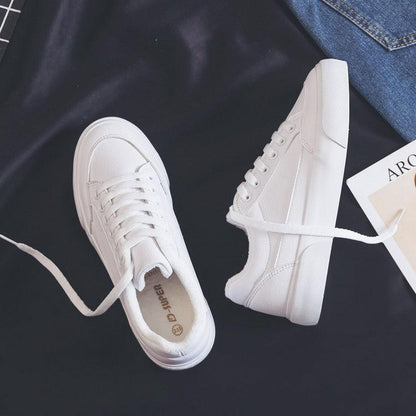 Pair of white Stevvex sneakers with lace-up casual sport style sole on Tampa Home & Garden Store