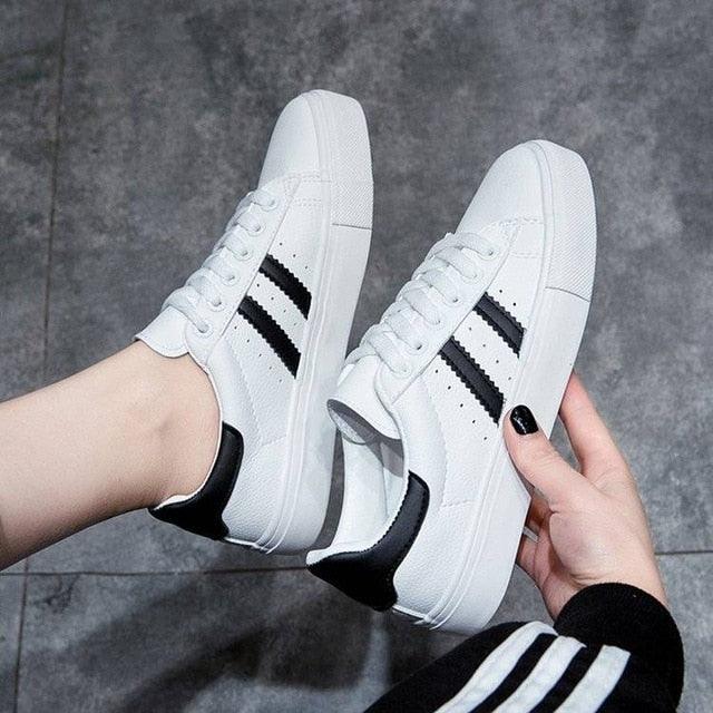 Stevvex Women White Casual Sneakers with black side stripes, lace-up, eco leather pair on Tampa Home & Garden Store