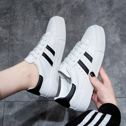 Stevvex Women White Casual Sneakers with black side stripes, lace-up, eco leather pair on Tampa Home & Garden Store