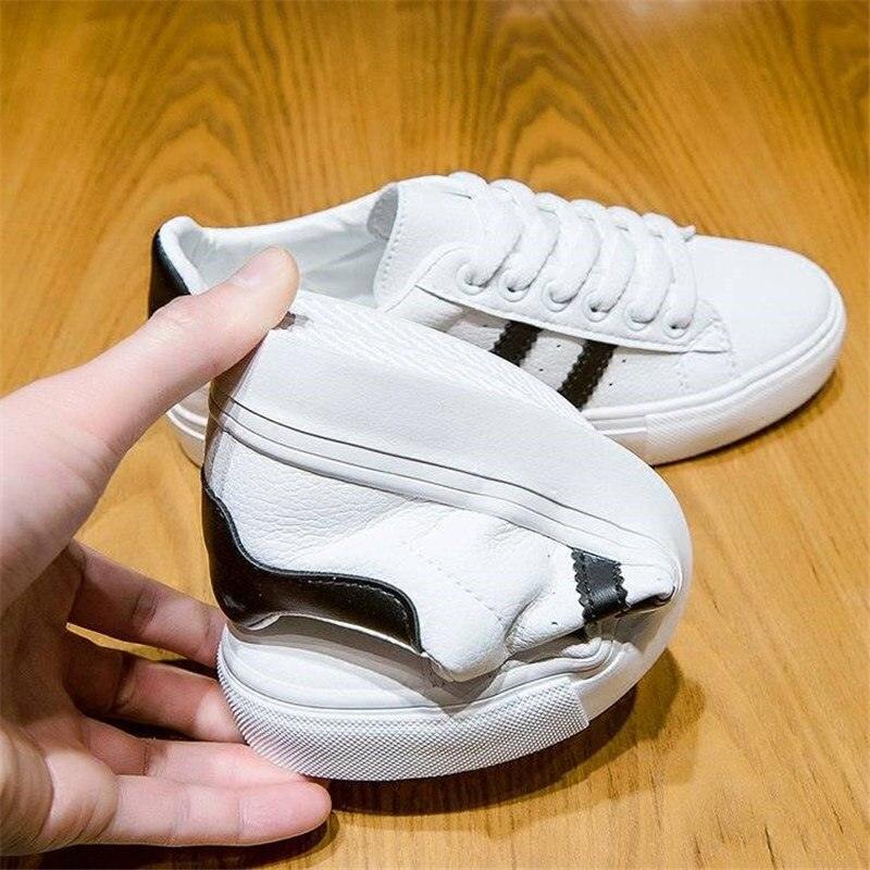 Women white casual sneakers with lace-up, black side stripe, eco leather Stevvex on Tampa Home & Garden Store