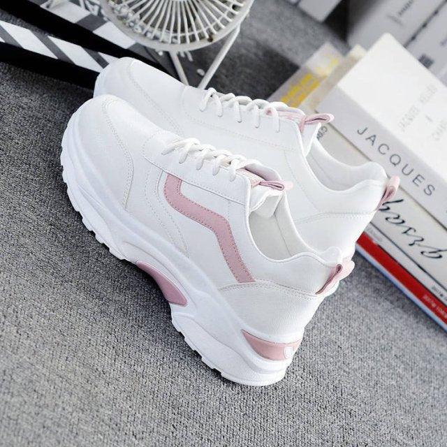 Women's white leather sneakers by Stevvex with pink side stripe, low-top lace-up, platform sole on Tampa Home & Garden Store