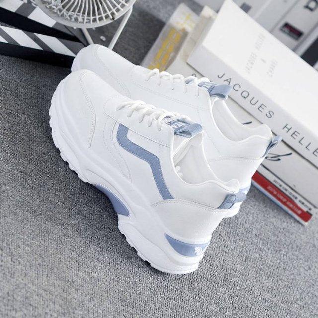 White leather sneakers with light blue accents, chunky platform sole, lace-up low-top on Tampa Home & Garden Store