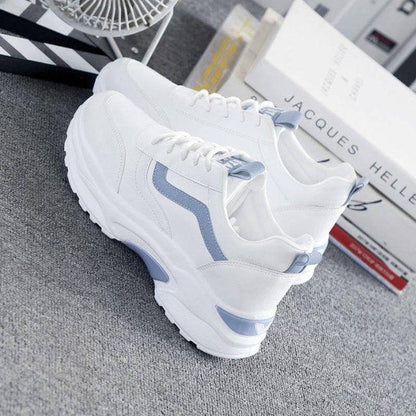White leather sneakers with light blue accents, chunky platform sole, lace-up low-top on Tampa Home & Garden Store