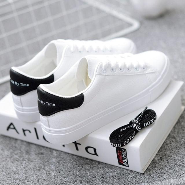 Women white lace-up leather sneakers with black heel tab and chunky sole on Tampa Home & Garden Store