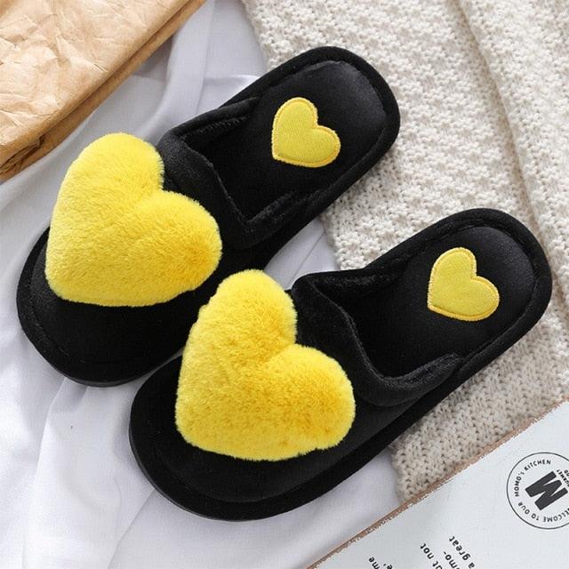 Stevvex women's black plush heart slippers with yellow heart accents, cushioned sole pair on Tampa Home & Garden Store