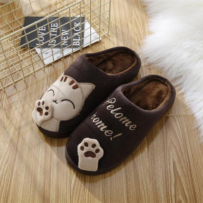Women brown plush cat slippers pair with paw design and Welcome home text for indoor wear on Tampa Home & Garden Store