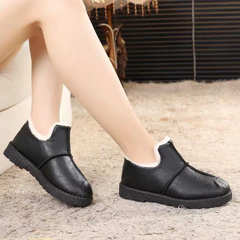 Stevvex women's black faux leather fur-lined booties with plush lining and non-slip sole, pair on Tampa Home & Garden Store