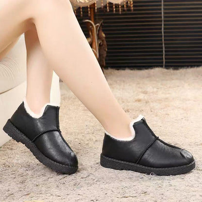 Stevvex women's black faux leather fur-lined booties with plush lining and non-slip sole, pair on Tampa Home & Garden Store