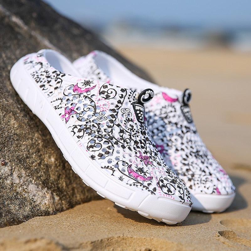 Womens slip-on sandals pair white floral print, Stevvex logo, quick-dry beach footwear on Tampa Home & Garden Store