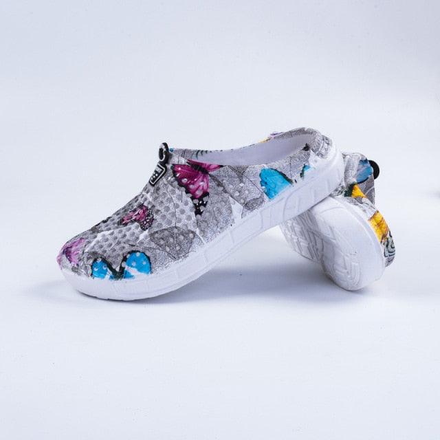 Stevvex womens butterfly-print clogs, breathable quick-dry slippers with white sole pair on Tampa Home & Garden Store