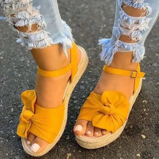 Stevvex women's yellow bow-strap sandals with ankle buckle and espadrille wedge sole on Tampa Home & Garden Store