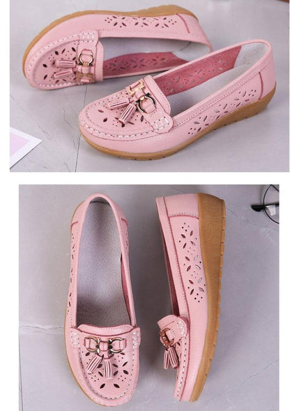 Stevvex pink leather flats with floral perforations and tassel accents, slip-on design, tan sole on Tampa Home & Garden Store
