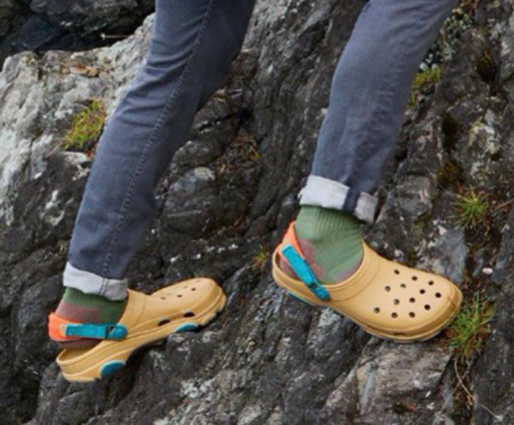 Comfy non-slip beach clogs by Stevvex, beige uppers with blue strap on a rocky trail on Tampa Home & Garden Store