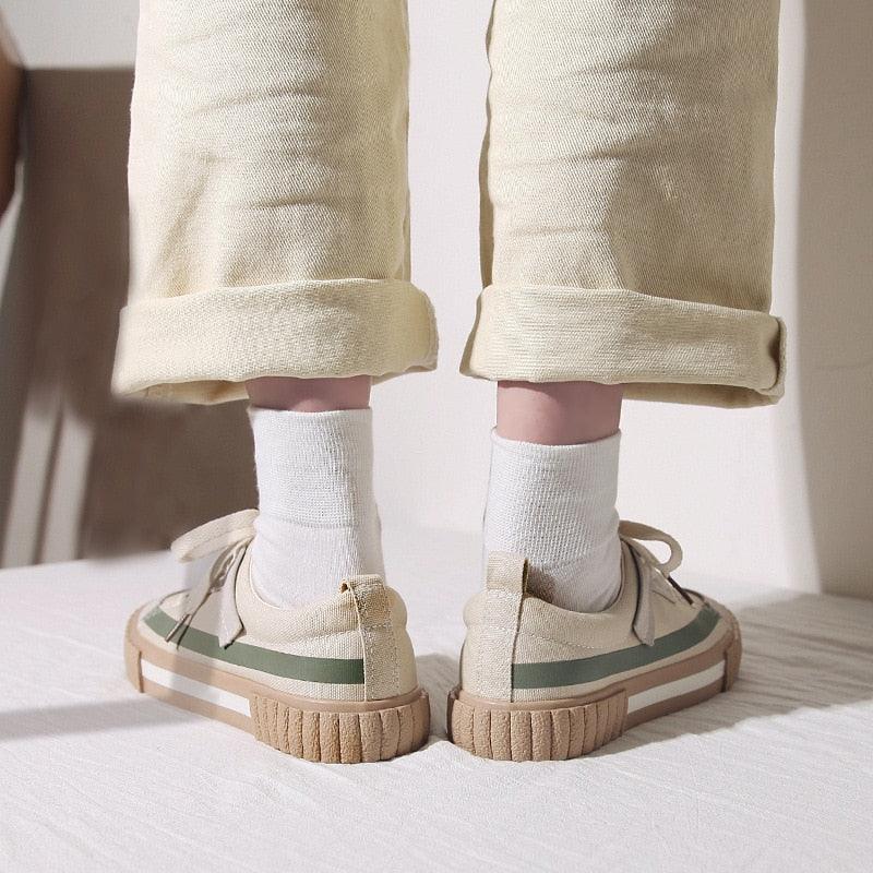 Stevvex canvas casual flats sneakers back view with green stripe beige upper tan sole on Tampa Home & Garden Store