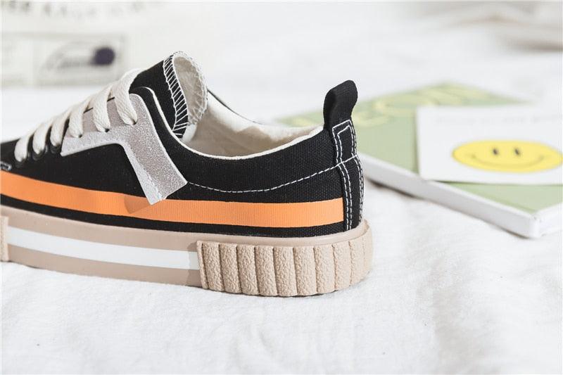 Stevvex canvas sneakers black upper with white laces and orange stripe on beige sole on Tampa Home & Garden Store