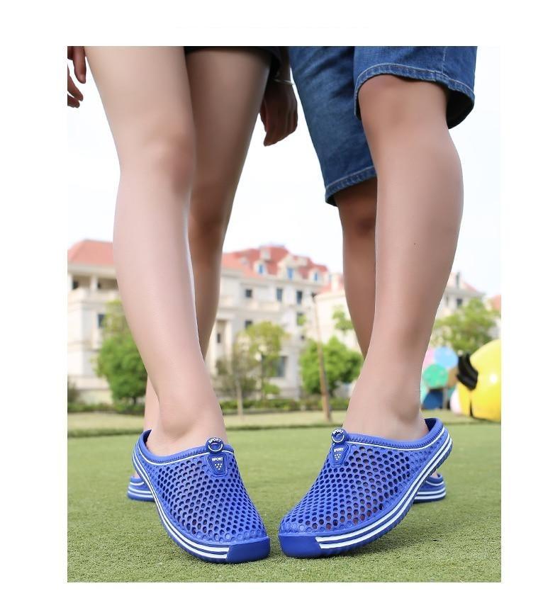 Stevvex blue perforated EVA sandals with hollow-out breathable mesh worn by two on grass on Tampa Home & Garden Store