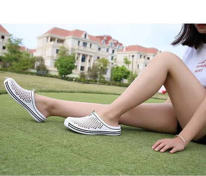 Stevvex women's white hollow-out slip-on sandals with perforated mesh EVA sole on grass on Tampa Home & Garden Store