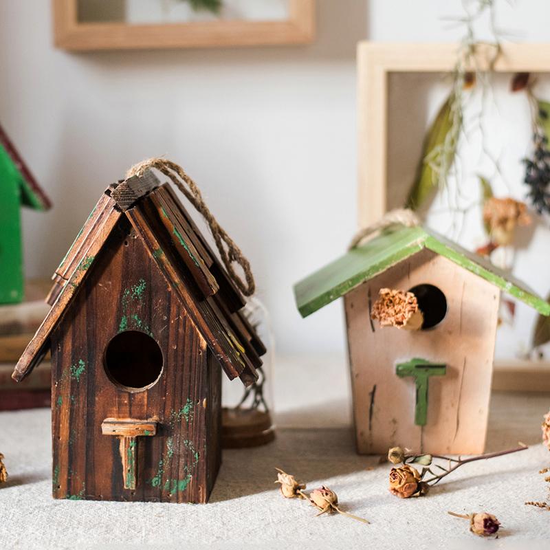 Two Wood Craft Bird's House Ornaments; dark stained with rope hanger and green roof on Tampa Home & Garden Store