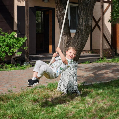 Wooden rope swing for kids; single swing with white rope attached to tree in backyard on Tampa Home & Garden Store
