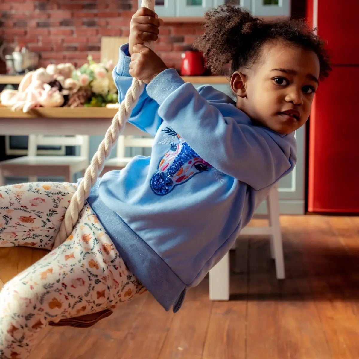 Wooden rope swing for kids, Goodevas single baby swing with rope in indoor kitchen scene on Tampa Home & Garden Store