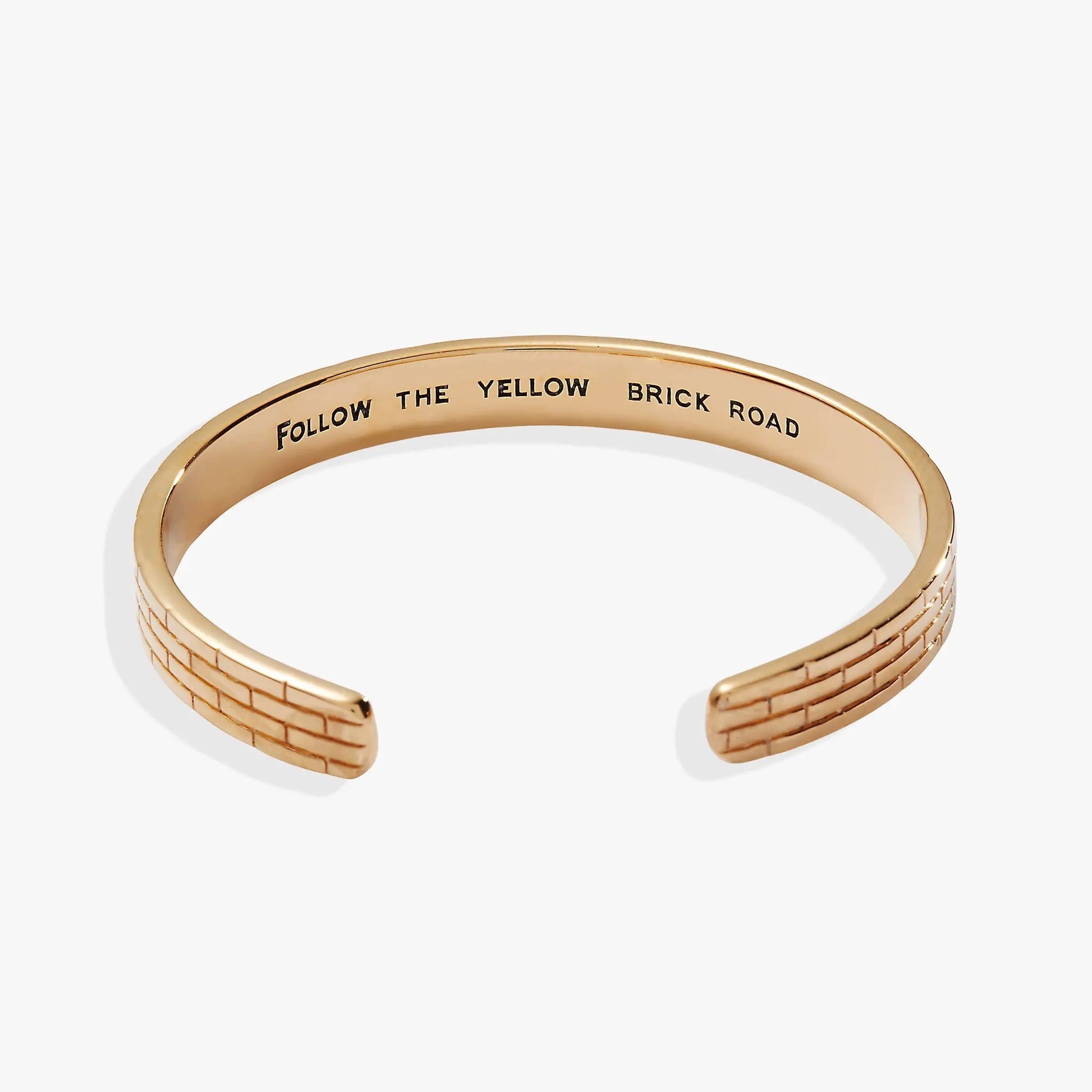 Bracelet The Wizard of Oz Yellow Brick Road cuff in gold-tone metal with engraved phrase on Tampa Home & Garden Store