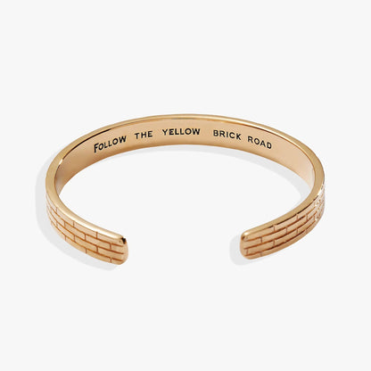 Bracelet The Wizard of Oz Yellow Brick Road cuff in gold-tone metal with engraved phrase on Tampa Home & Garden Store