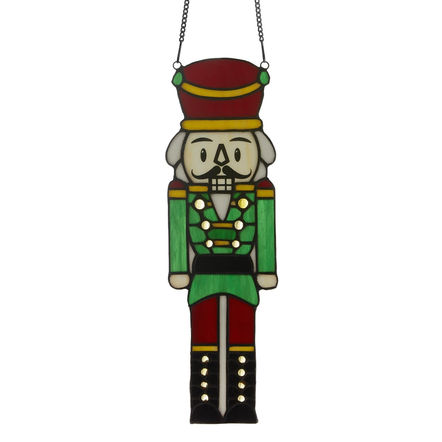Hans the Holiday Nutcracker stained glass window panel with green uniform and red hat on Tampa Home & Garden Store