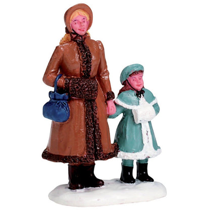 Day in Town Village Figurine set two winter villagers brown coat teal outfit on snowy base on Tampa Home & Garden Store