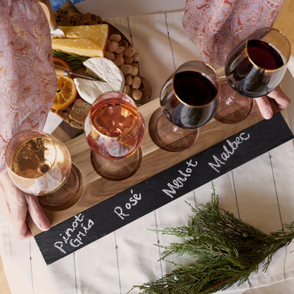 Acacia wood wine flight board with cheese, crackers, almonds and several red wine glasses on Tampa Home & Garden Store