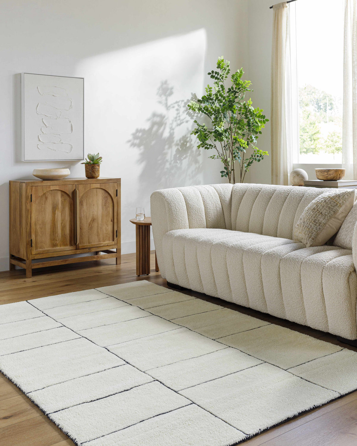 Xylia Ivory Area Rug Boutique Rugs, plush ivory with grid seam panels in a bright living room on Tampa Home & Garden Store