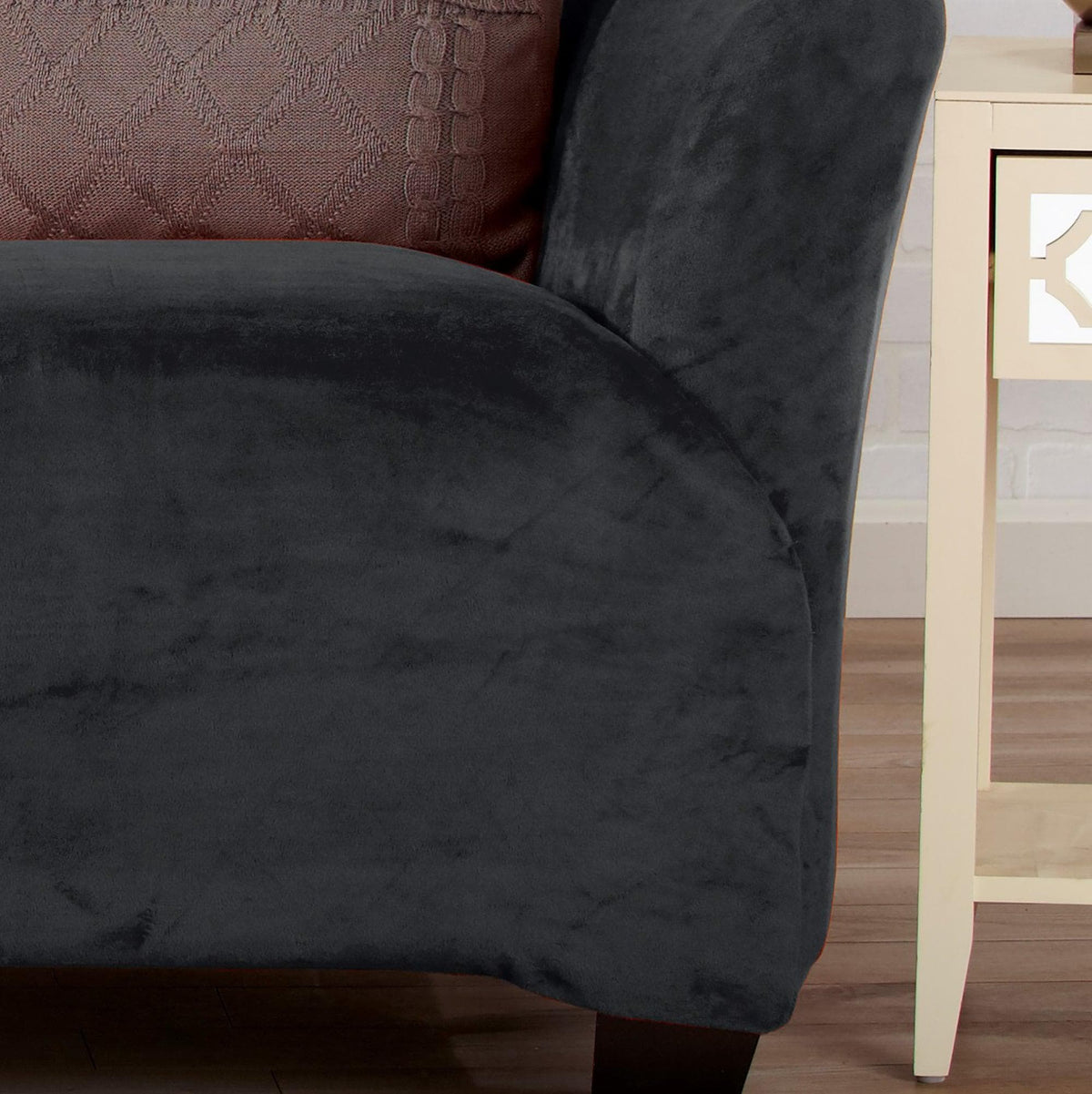 Velvet Stretch Slipcover Gale Collection by Great Bay Home in dark charcoal on a sofa with a textured rust cushion on Tampa Home & Garden Store