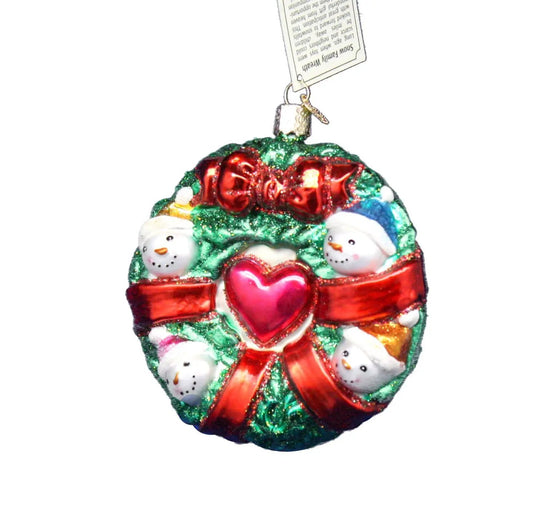 Old World Christmas Snowman Family Wreath ornament with glittery green wreath and red bow on Tampa Home & Garden Store