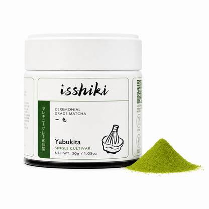 Isshiki Yabukita matcha powder jar with green label beside a mound of bright green matcha on Tampa Home & Garden Store