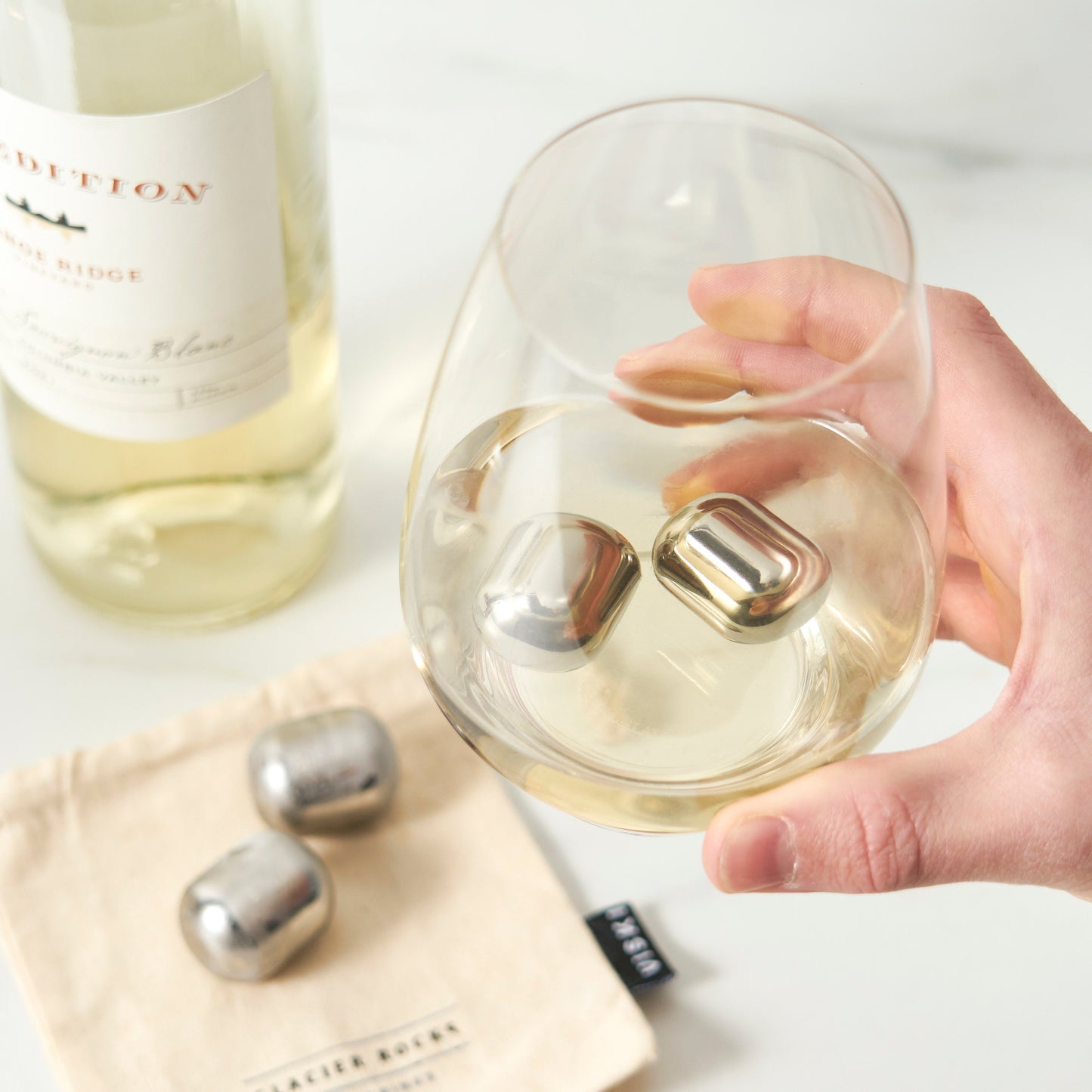 a Set of Four Stainless Steel Wine Chilling Rocks
