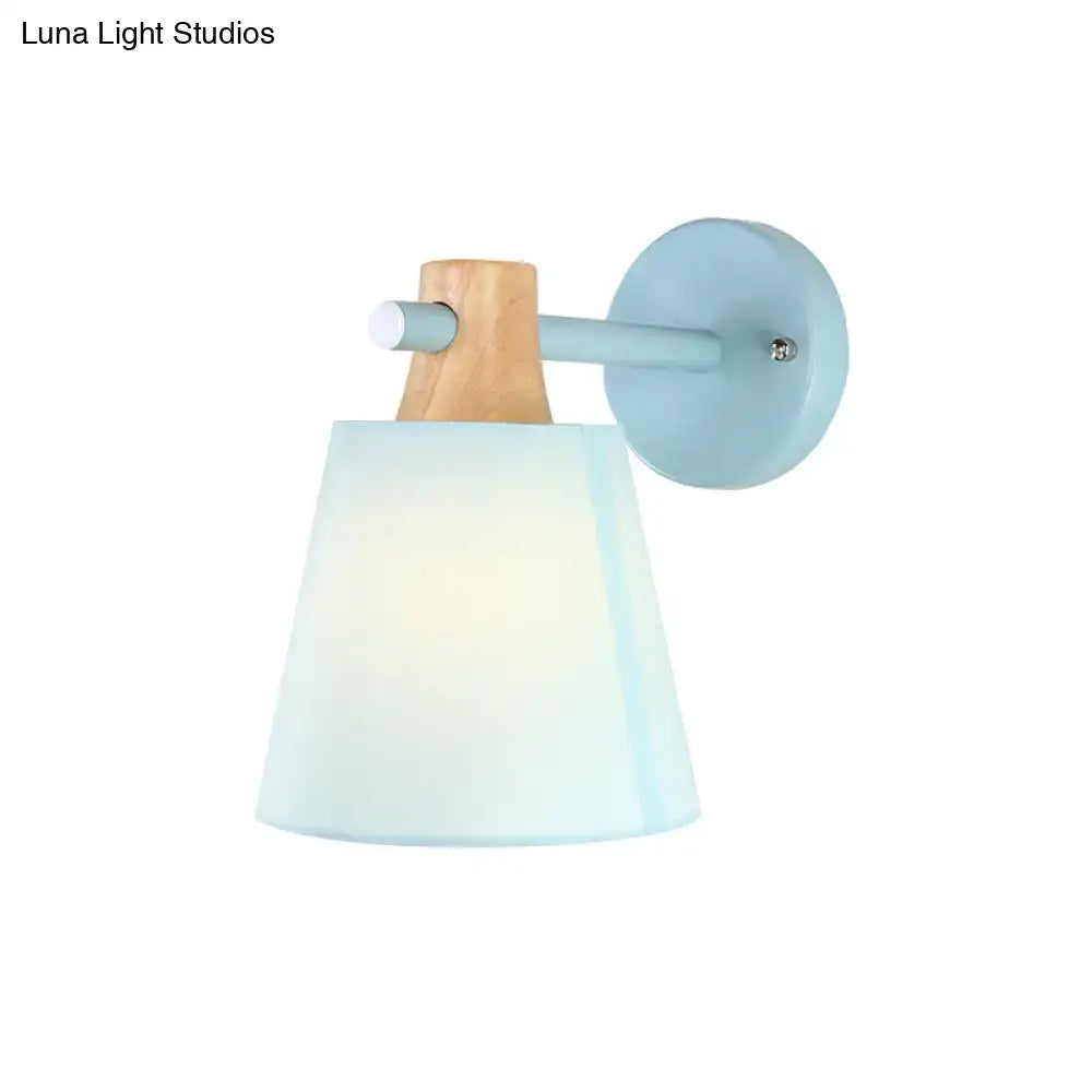 Blue macaron fabric wall light with wood accent sconce mounted on round wall plate on Tampa Home & Garden Store